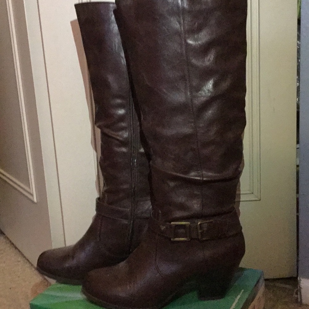 Brown heeled knee high boots